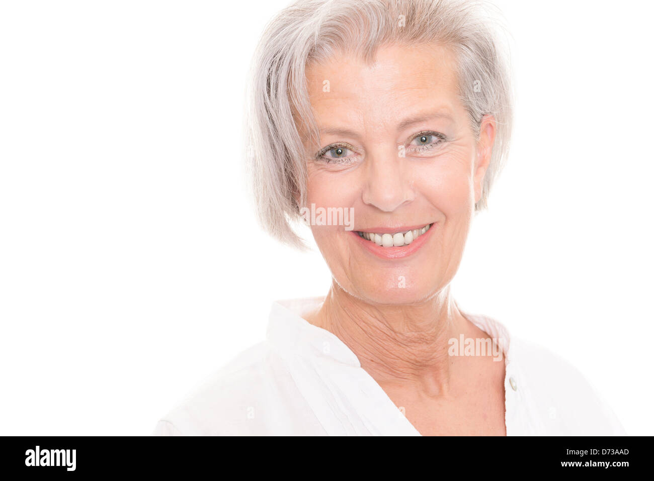 Smiling senior woman in front of white background Stock Photo - Alamy
