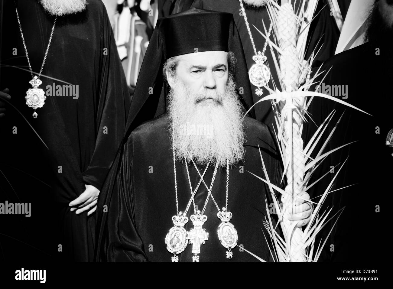 Patriarch Theophilos III of Jerusalem (C) leads a procession towards the Church of The Holy Sepulchre for prayer and worship on Eastern Orthodox Palm Sunday. Jerusalem, Israel. 28-April-2013.  Eastern Orthodox Christians celebrate Palm Sunday, based on the Julian calendar, at the Church of The Holy Sepulchre. Stock Photo