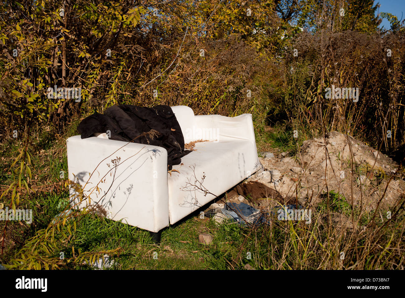 used sofa garbage discarded outdoors in meadow Stock Photo Alamy