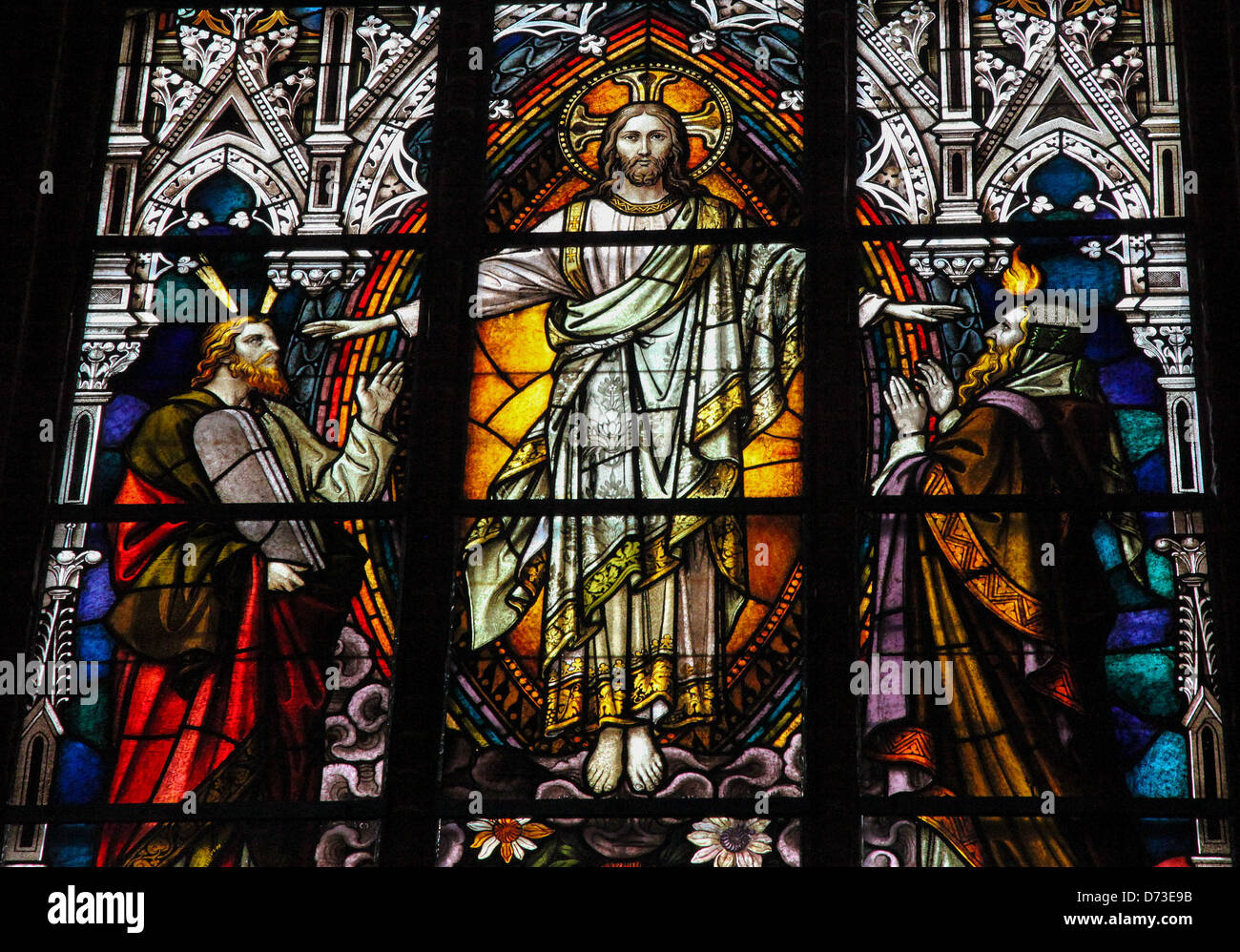 Stained glass window depicting Jesus Christ, Moses with the Ten Commandments and the Prophet Iesaiah. Stock Photo