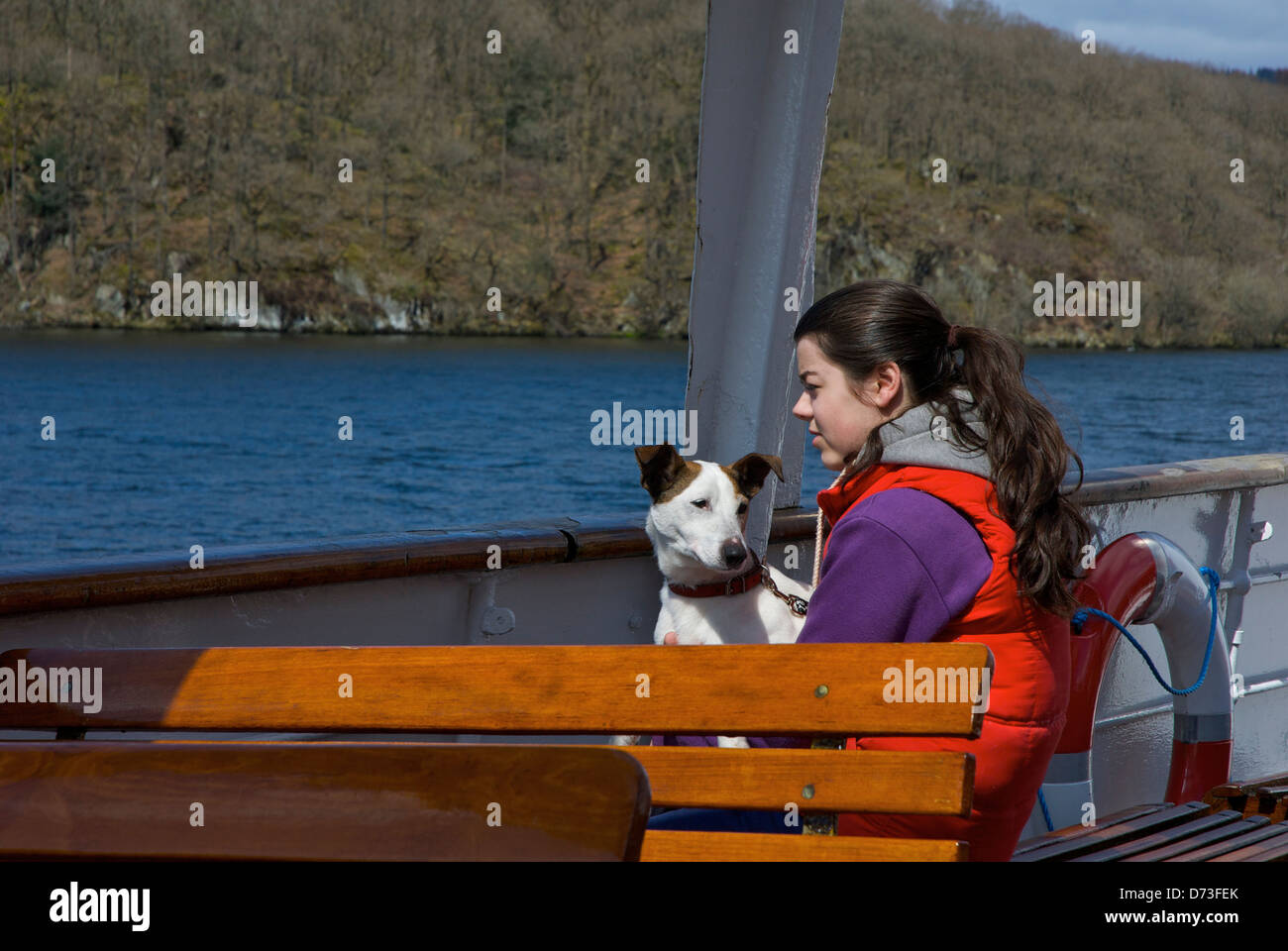 Girl and her dog on passenger steamer on Lake Windermere, Lake District