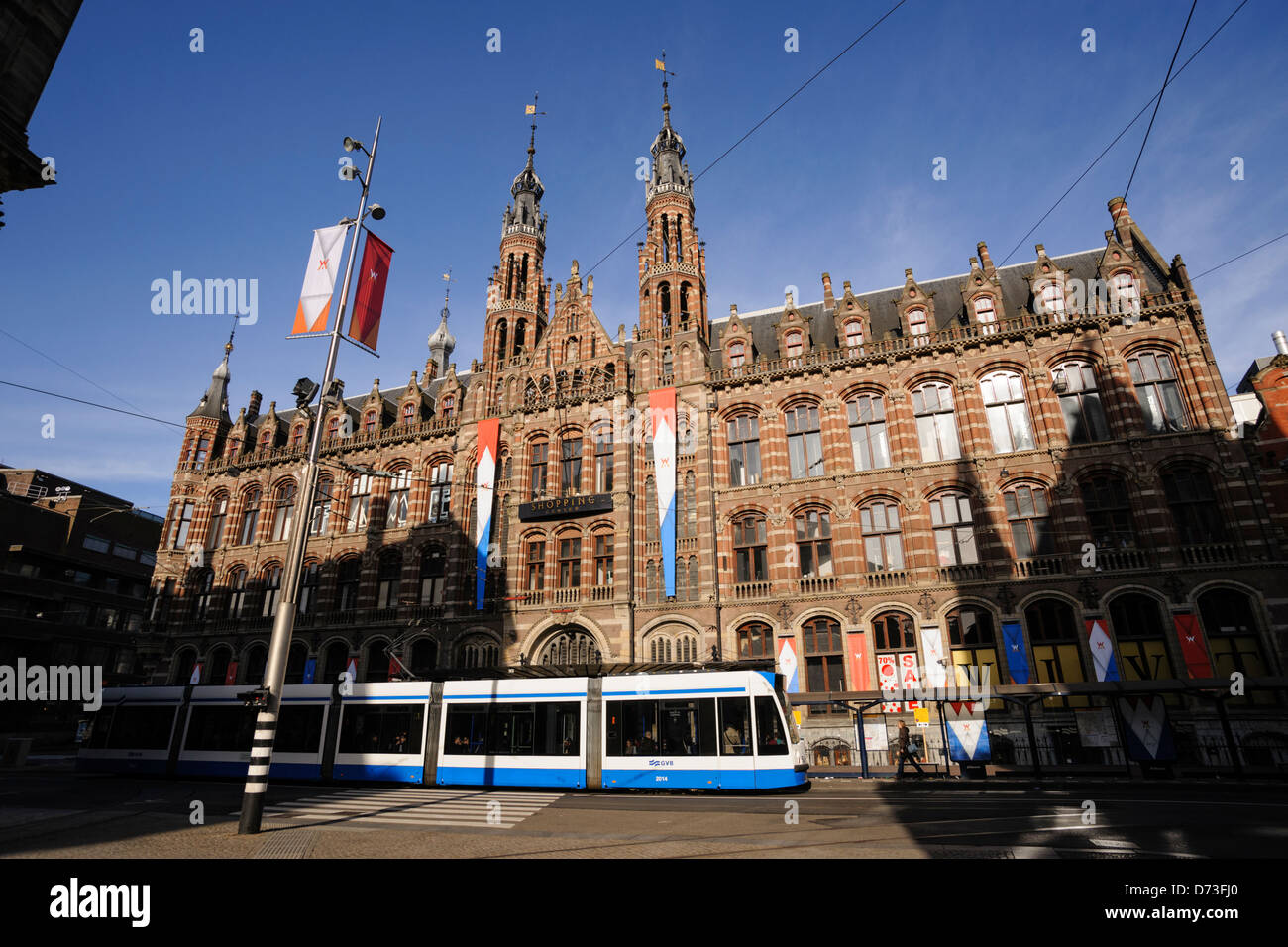 National flags of the Netherlands adorn the facade of a department store in Amsterdam, 27 April 2013 Stock Photo