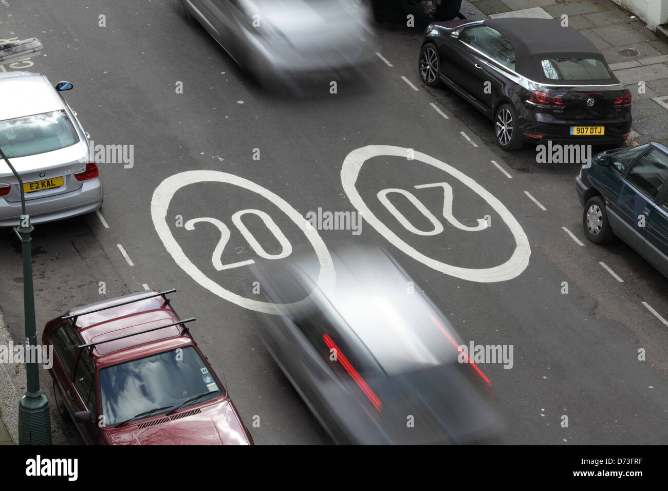 20 mph speed limit signs painted on the road surface in Hove, East Sussex. Stock Photo