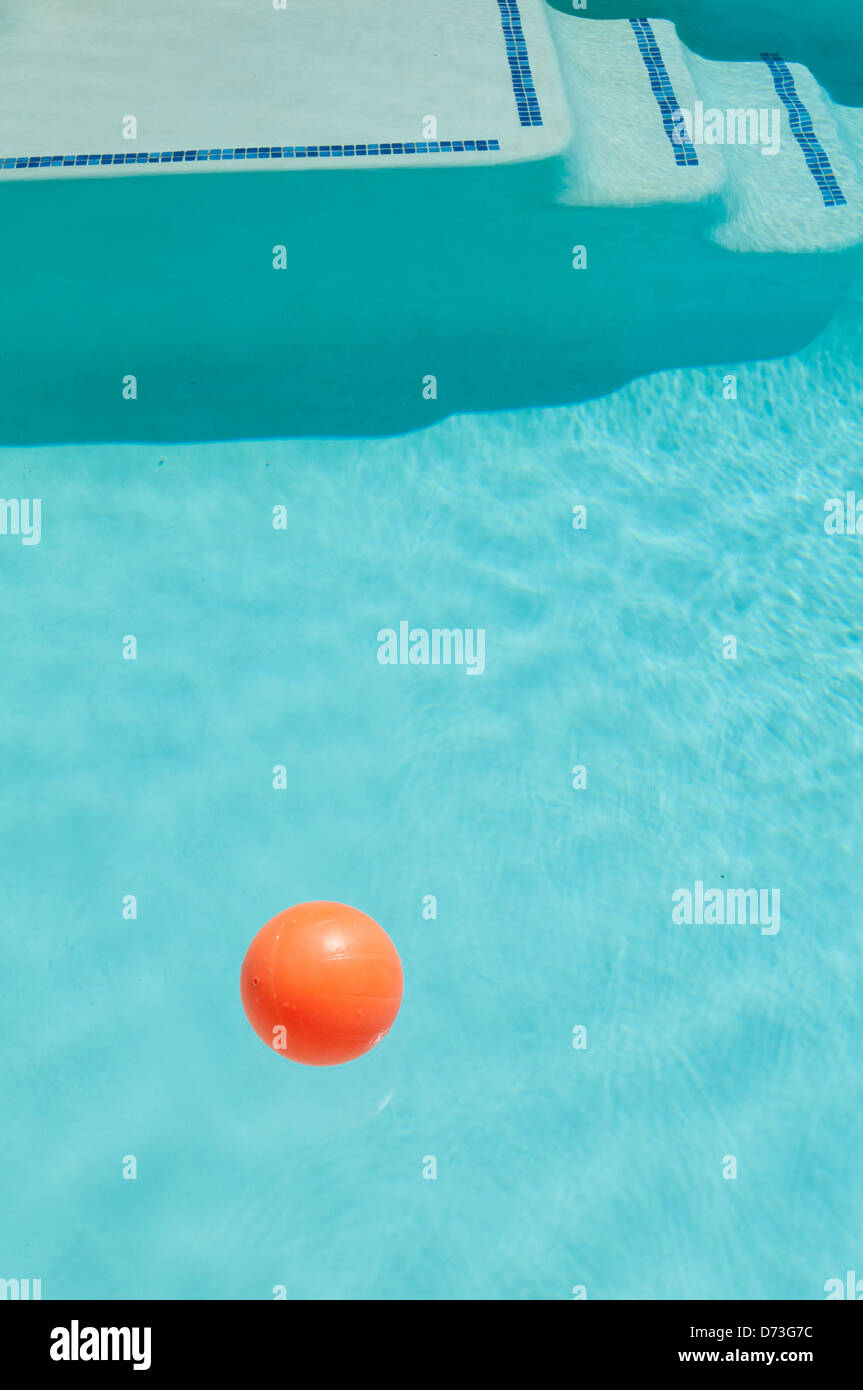 Orange ball in a swimming pool Stock Photo Alamy