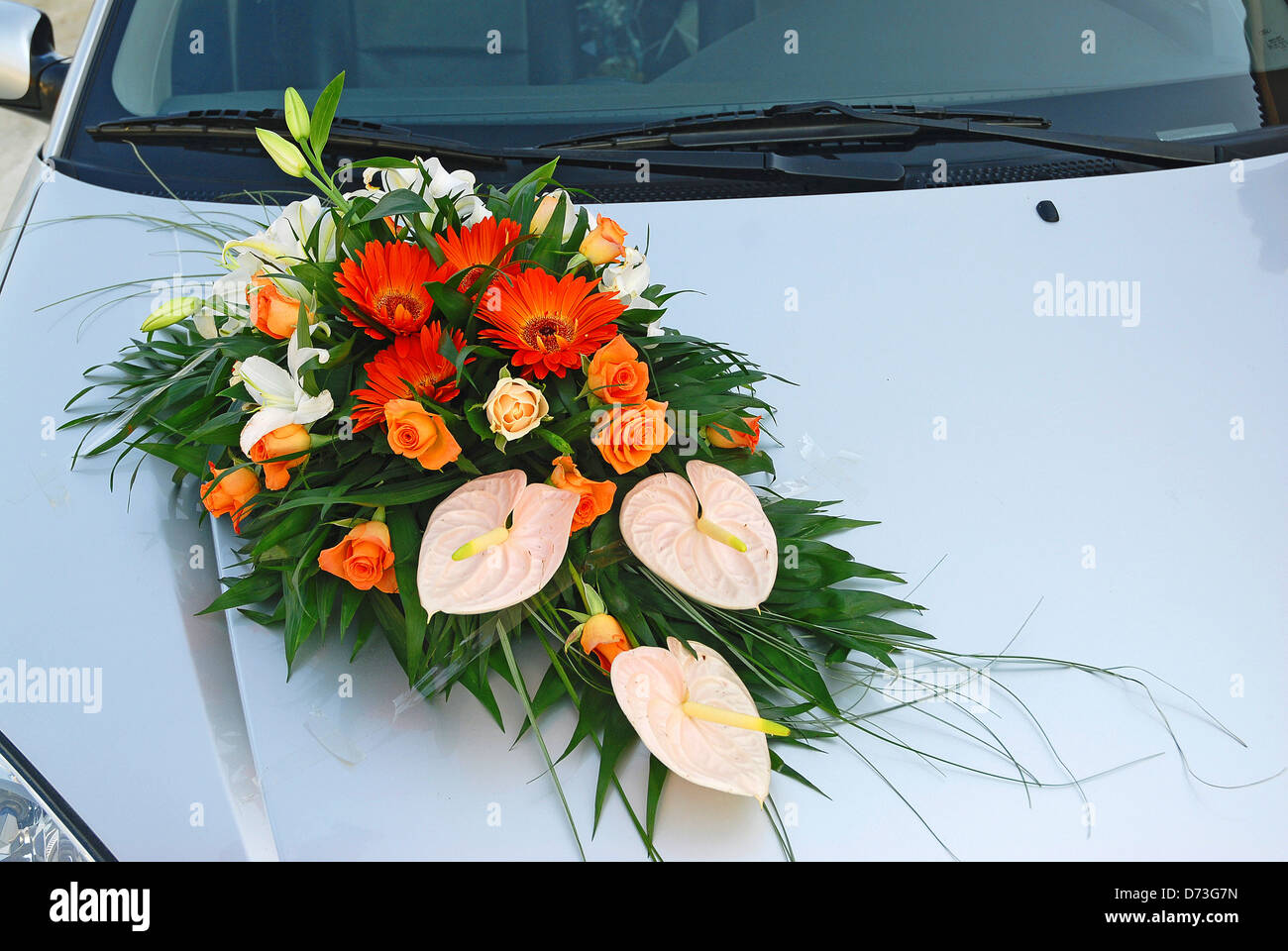 Floral arrangement on wedding car Stock Photo