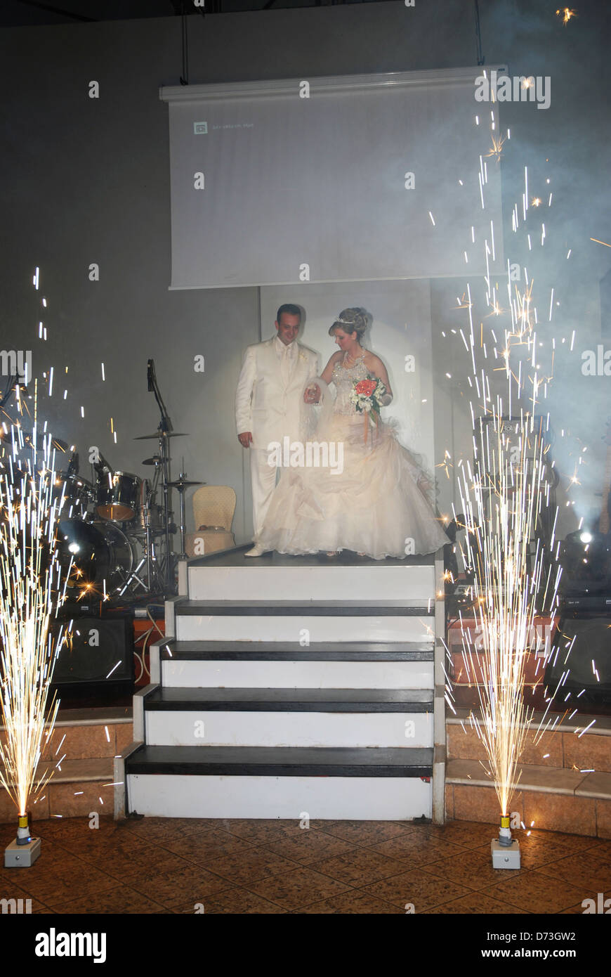 Bride and groom arriving at wedding reception venue (Greece) Stock Photo