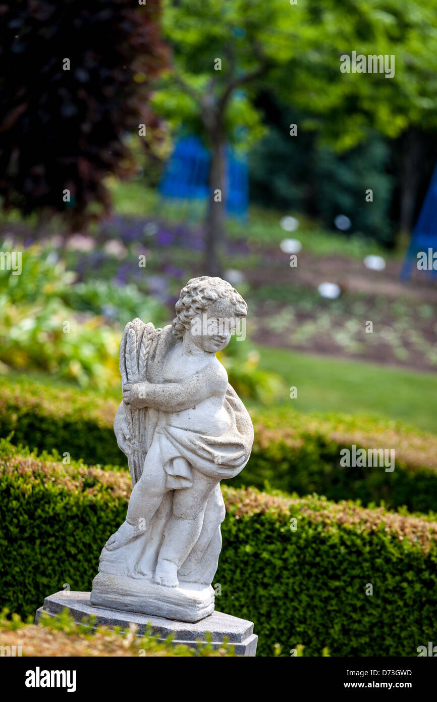 concrete cherub sculpture in a garden Stock Photo Alamy