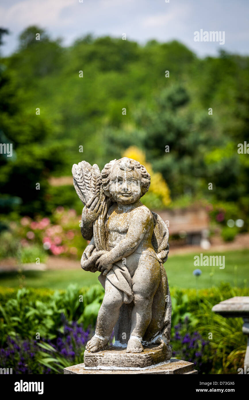 concrete cherub sculpture in a garden Stock Photo Alamy