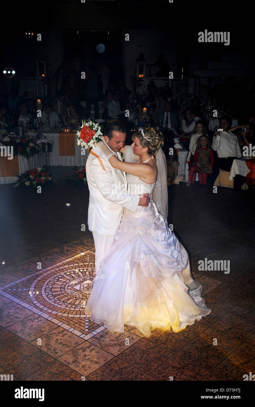 Bride and groom at their first dance on wedding reception (Greece) Stock Photo