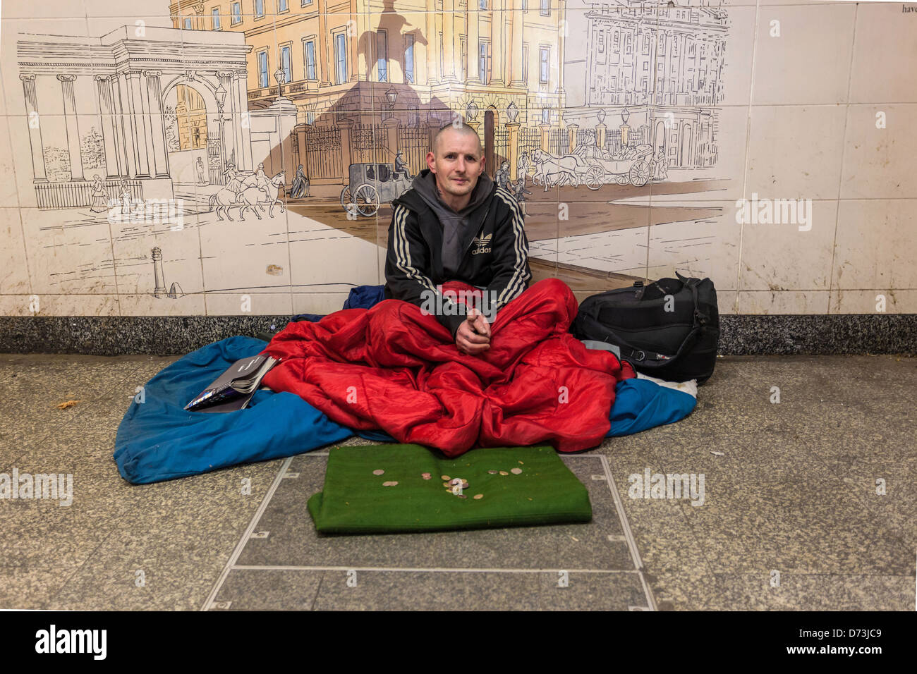 Homeless man begging for money in a dirty underpass, London, England, UK. Stock Photo
