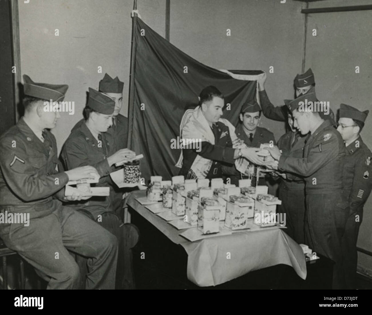 Chaplain Dicker hands out Hanukah gifts to soldiers in Austria, 1951 Stock Photo