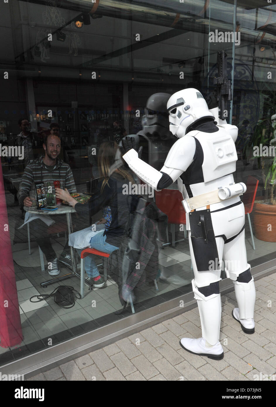 Stratford, London, UK. 28th April 2013. A 'Storm Trooper' from Star Wars intimidates people in Pizza Express at the costume parade. The Sci-Fi-London Costume Parade opens the 12th annual International Festival of Science Fiction and Fantastic Film held at Stratford Picture House in East London. Alamy Live News Stock Photo