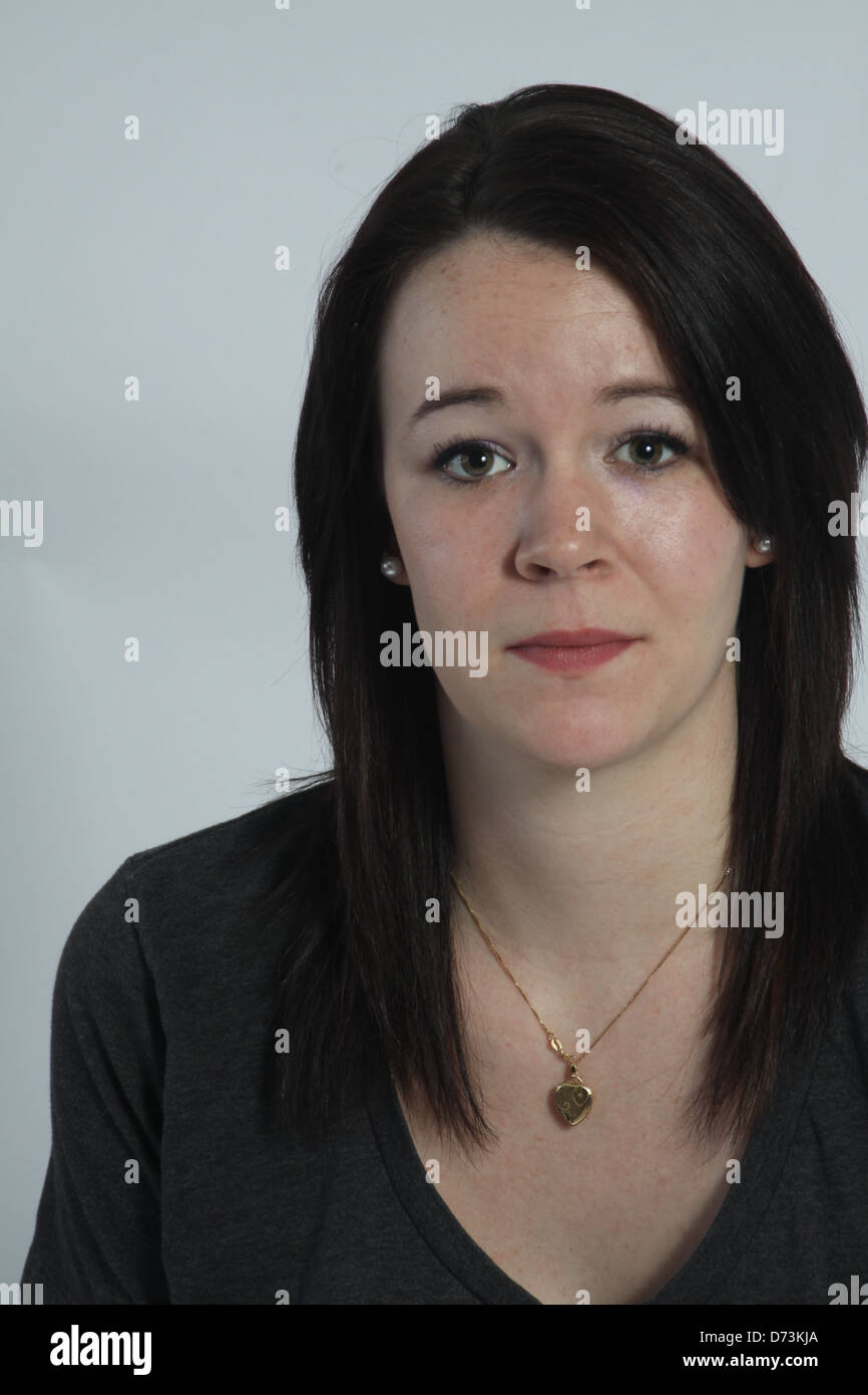 Head and shoulders of a very pretty young lady, in tshirt Stock Photo