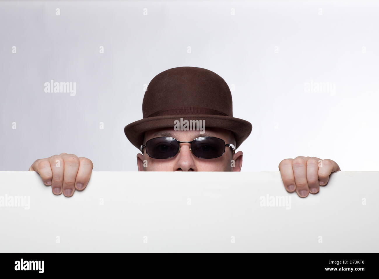 hat, hands, brown, sunglasses, surprise, bald, white wall Stock Photo