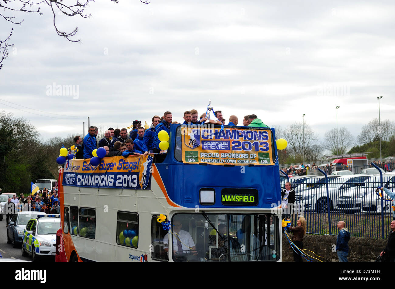 28th April 2013, Mansfield, Nottinghamshire, UK. Mansfield Town F.C. celebrate promotion back to league football next season (2013-2014)with an open top bus tour of the town.Fans turned out along the route singing and chanting as the team bus past by. Alamy Live News. Stock Photo