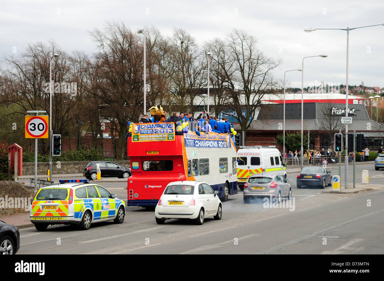 28th April 2013, Mansfield, Nottinghamshire, UK. Mansfield Town F.C. celebrate promotion back to league football next season (2013-2014)with an open top bus tour of the town.Fans turned out along the route singing and chanting as the team bus past by. Alamy Live News. Stock Photo