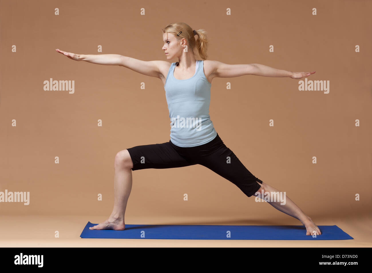 blonde girl practicing yoga Stock Photo