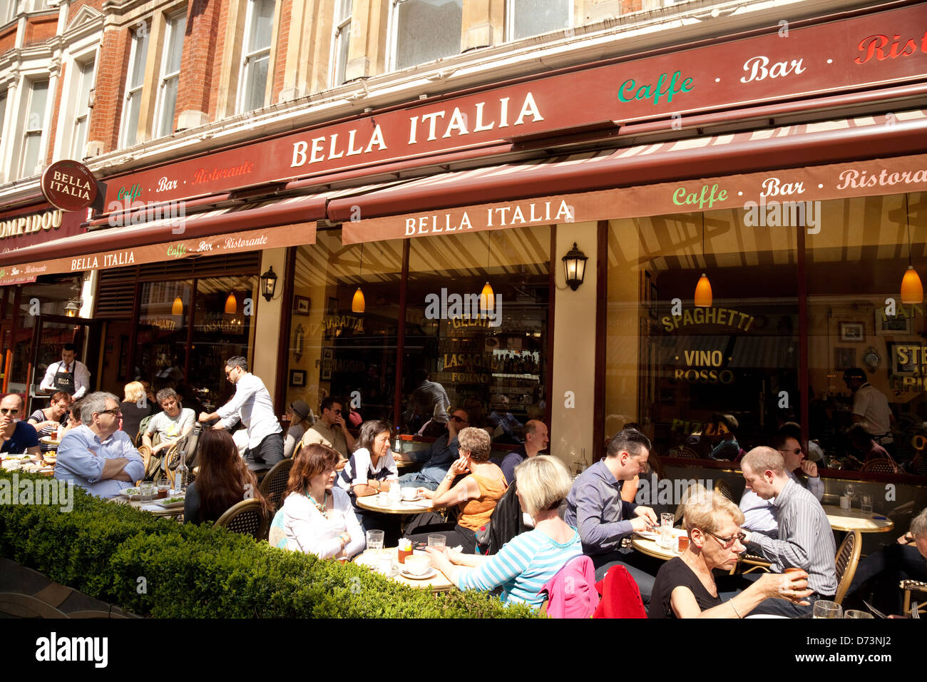 Bella Italia italian restaurant, people eating outside, Leicester Square, central London UK Stock Photo