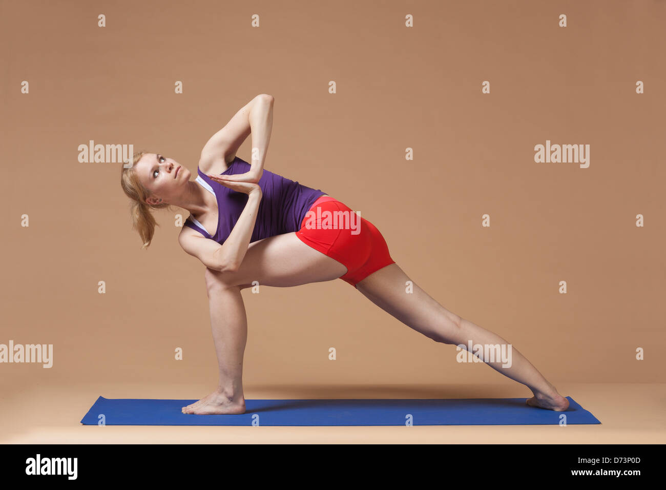 blonde girl practicing yoga Stock Photo