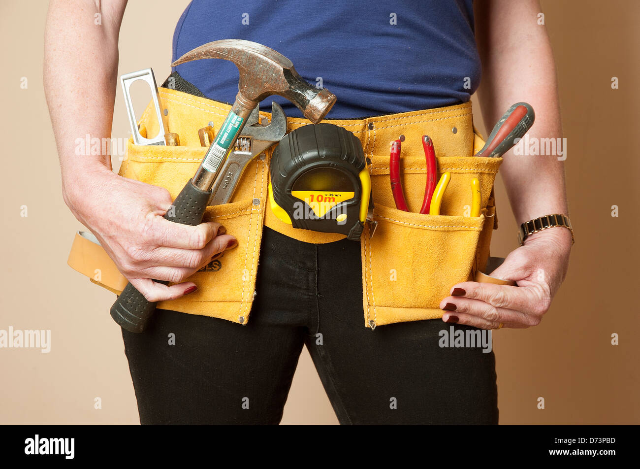 Female worker wearing a toolbelt work apron for tools Stock Photo Alamy