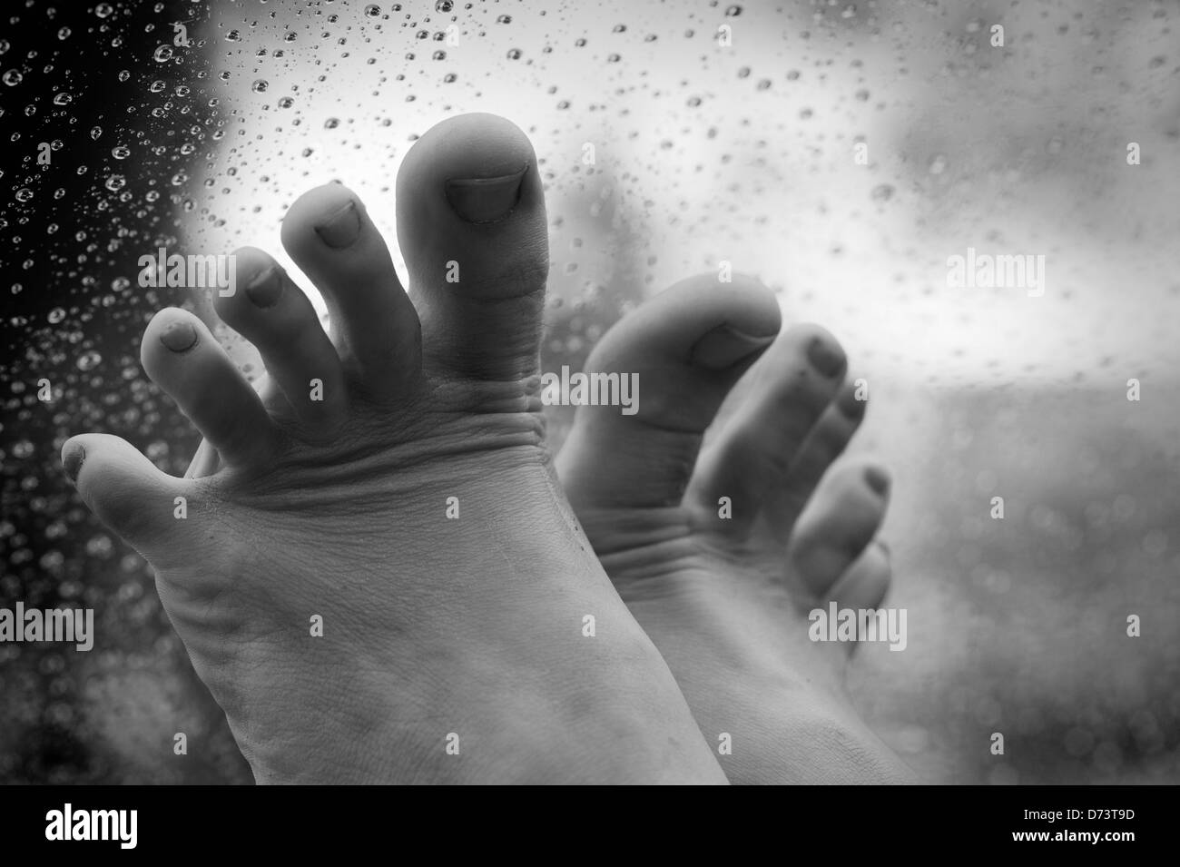 girl's feet on a car dashboard Stock Photo