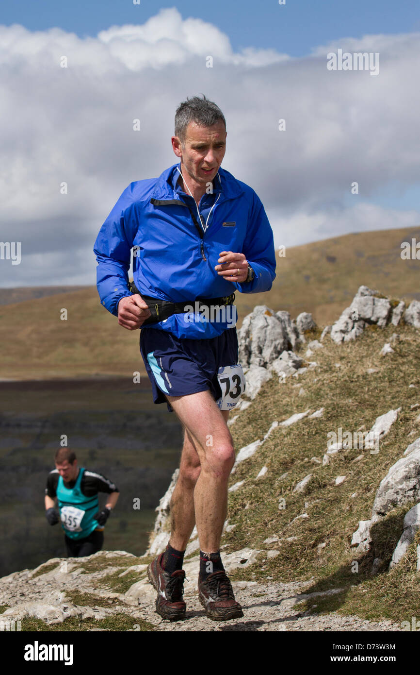 Yorkshire Three Peaks Challenge Saturday 27th April, 2013. The 59th Annual 3 Peaks Race with 1000 fell runners starting at the Playing Fields, Horton in Ribblesdale, Nr, Settle, UK.  Pen-y-Ghent is the first peak to be ascended then Whernside and finally the peak of Ingleborough. The race timed using the SPORTident Electronic Punching system. Stock Photo