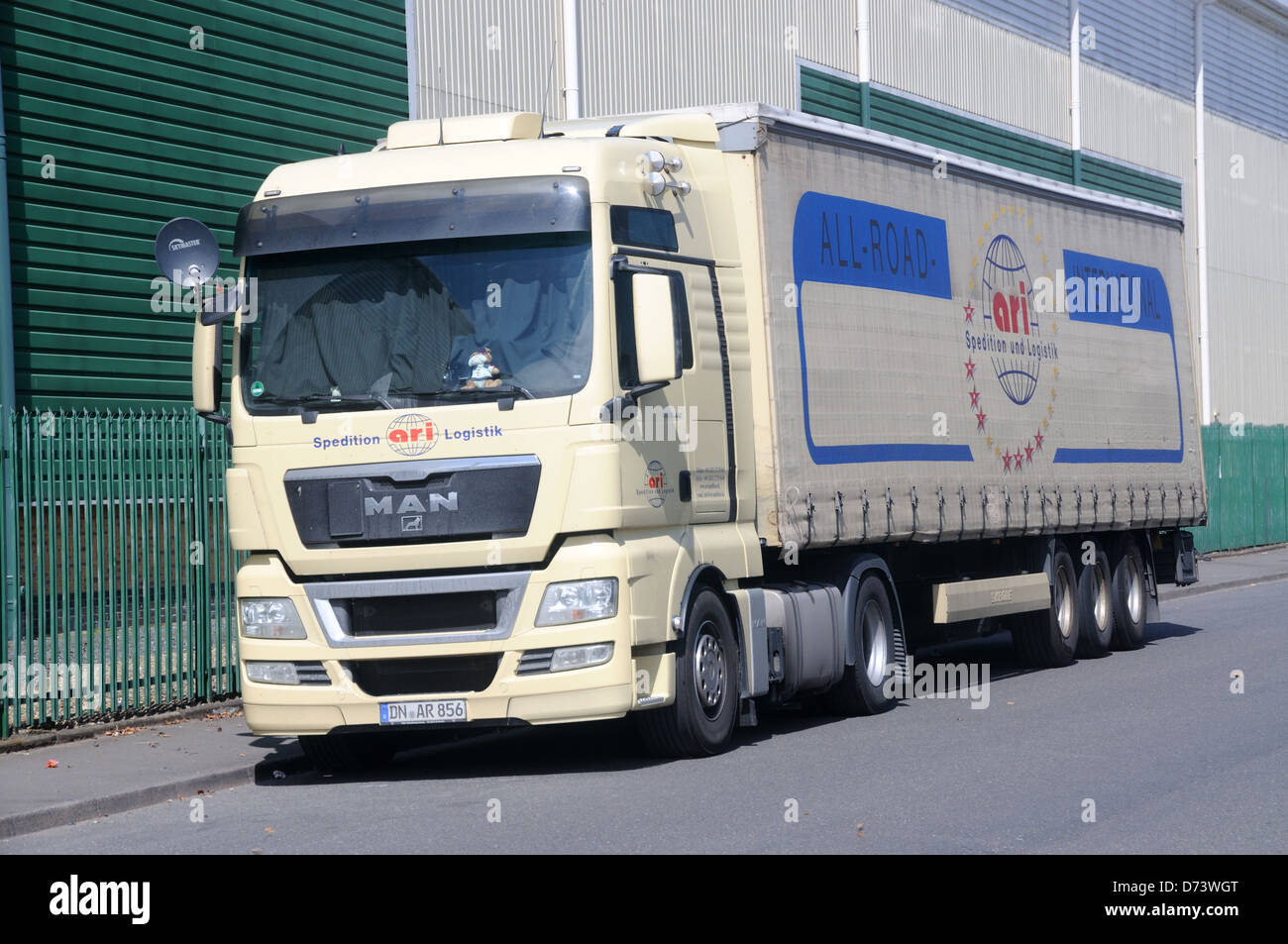 A MAN TGX 18.440 tractor unit and trailer in the livery of German carrier ARI in Leicester, Leicestershire, England Stock Photo