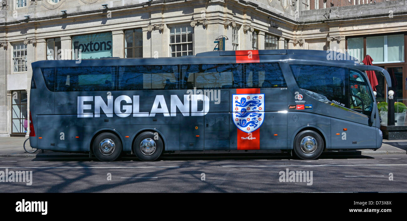 England football team coach parked outside the Grosvenor house Hotel Park Lane Mayfair London England UK Stock Photo
