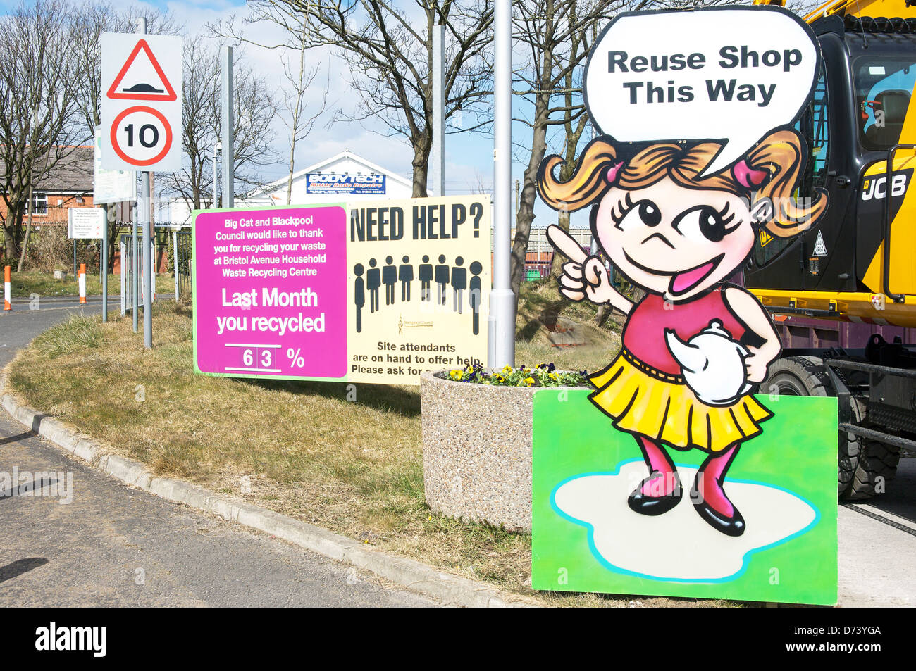 Cardboard cutout of little girl pointing to the Reuse shop on the household waste recycling centre,Blackpool Stock Photo