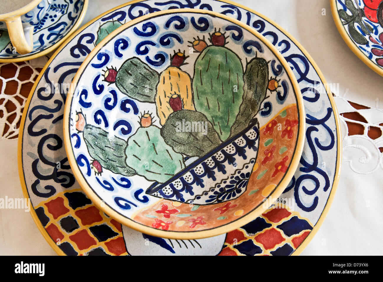 beautiful pottery plate & bowl designed by contemporary Mexican artist displayed in showroom Uriarte Talavera factory Puebla Stock Photo