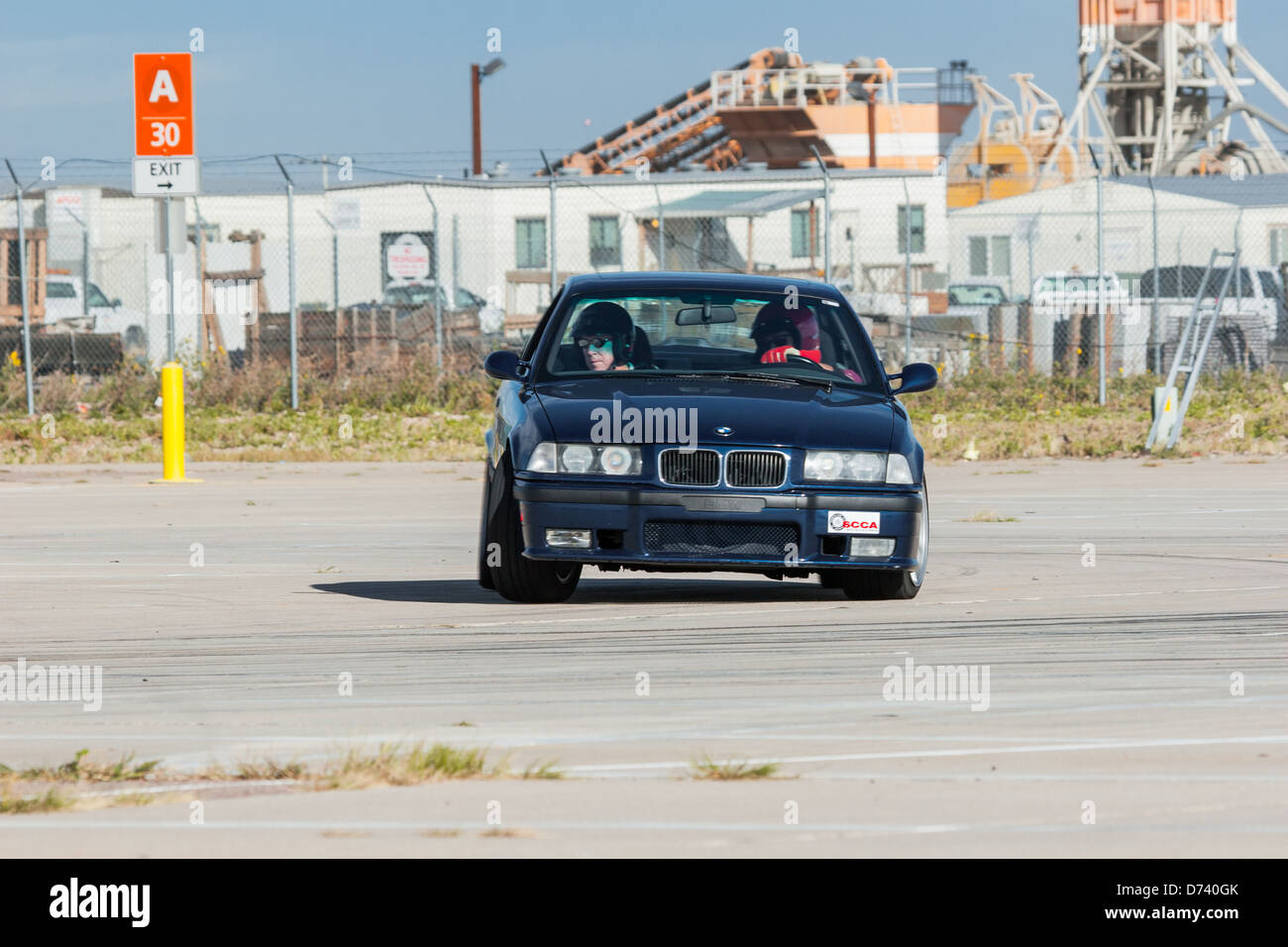 A 1995 Black BMW M3 in an autocross race at a regional Sports Car Club ...