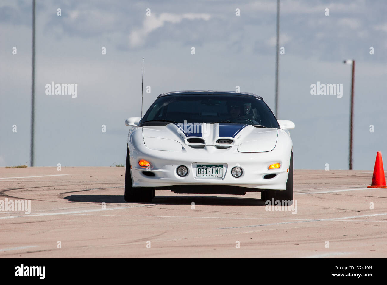 A 2001 white and blue Pontiac Trans Am automobile in an autocross race at a regional Sports Car Club of America (SCCA) event Stock Photo