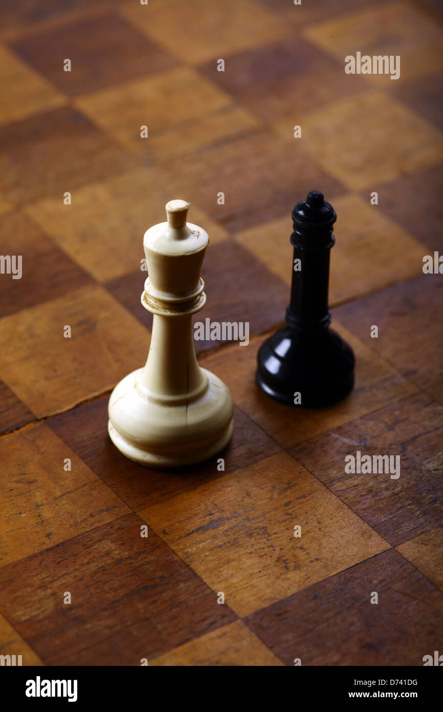 A black queen and a white king on a chess board Stock Photo - Alamy