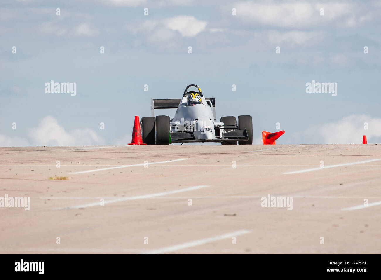 A 2002 Pocket Rocket DC2 gray BModified open wheel race car in an