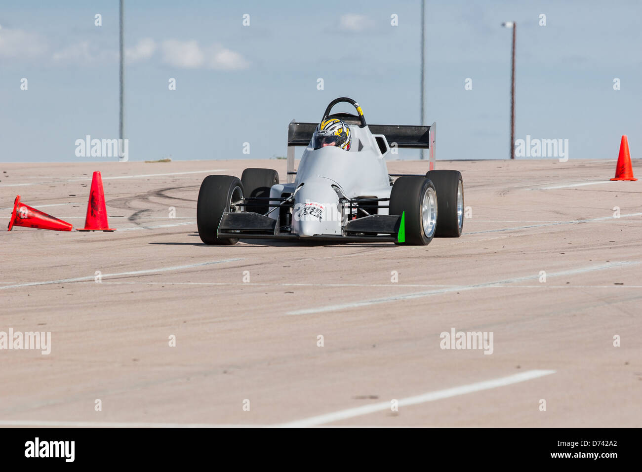 A 2002 Pocket Rocket DC2 gray BModified open wheel race car in an