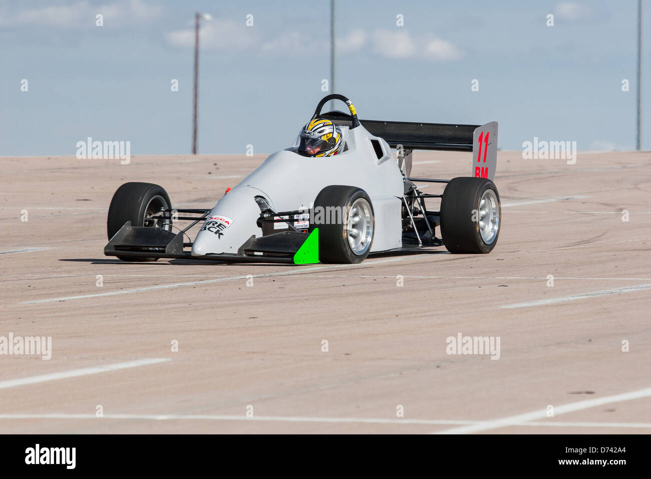 A 2002 Pocket Rocket DC2 gray BModified open wheel race car in an