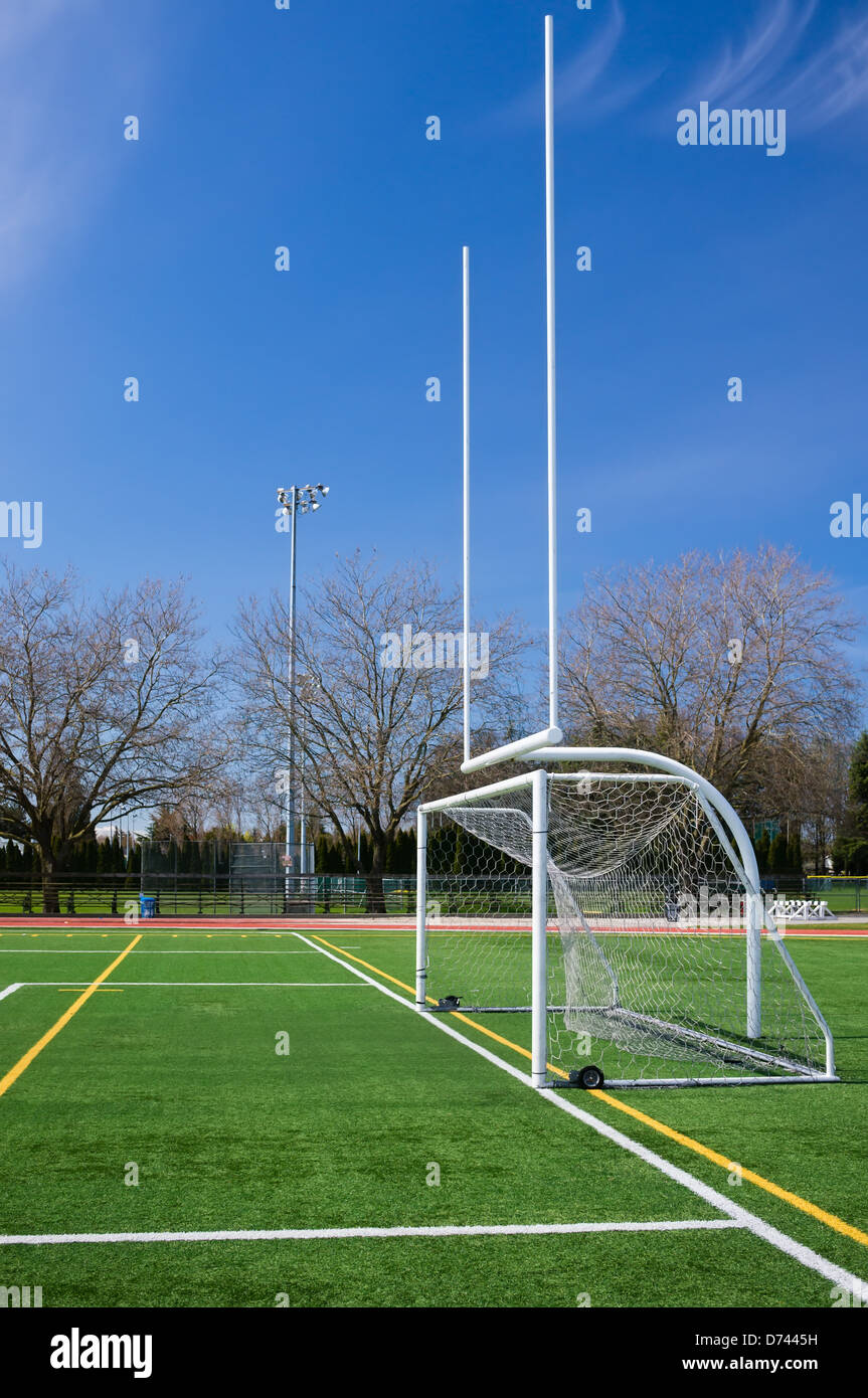 Football and soccer gates on artificial turf field Stock Photo Alamy
