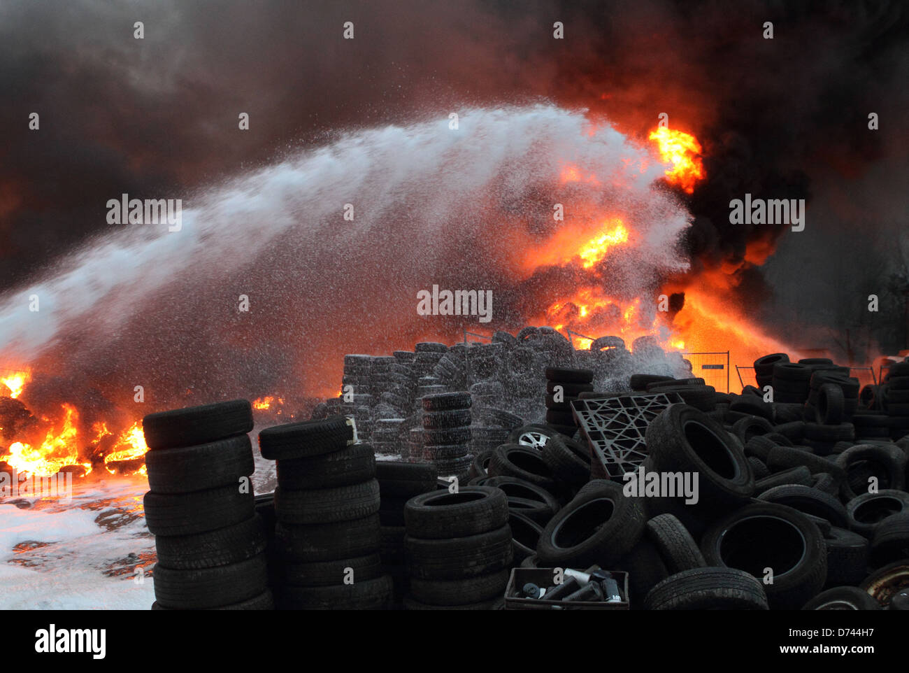 Berlin, Germany, fire fighting in a major fire in a warehouse used tires Stock Photo