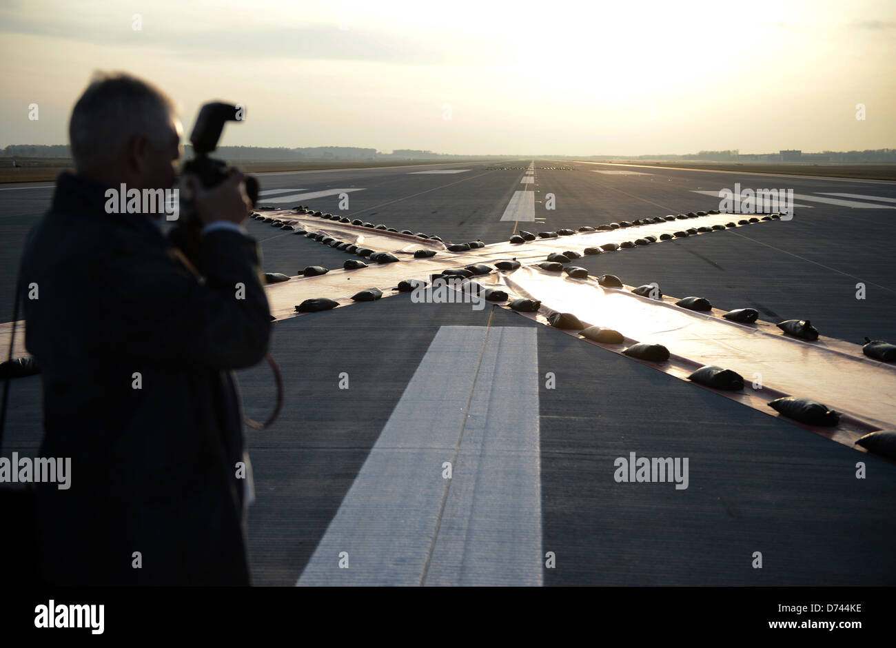 Schoenefeld, Germany, cross of plastic sheeting on the runway of the BER Stock Photo