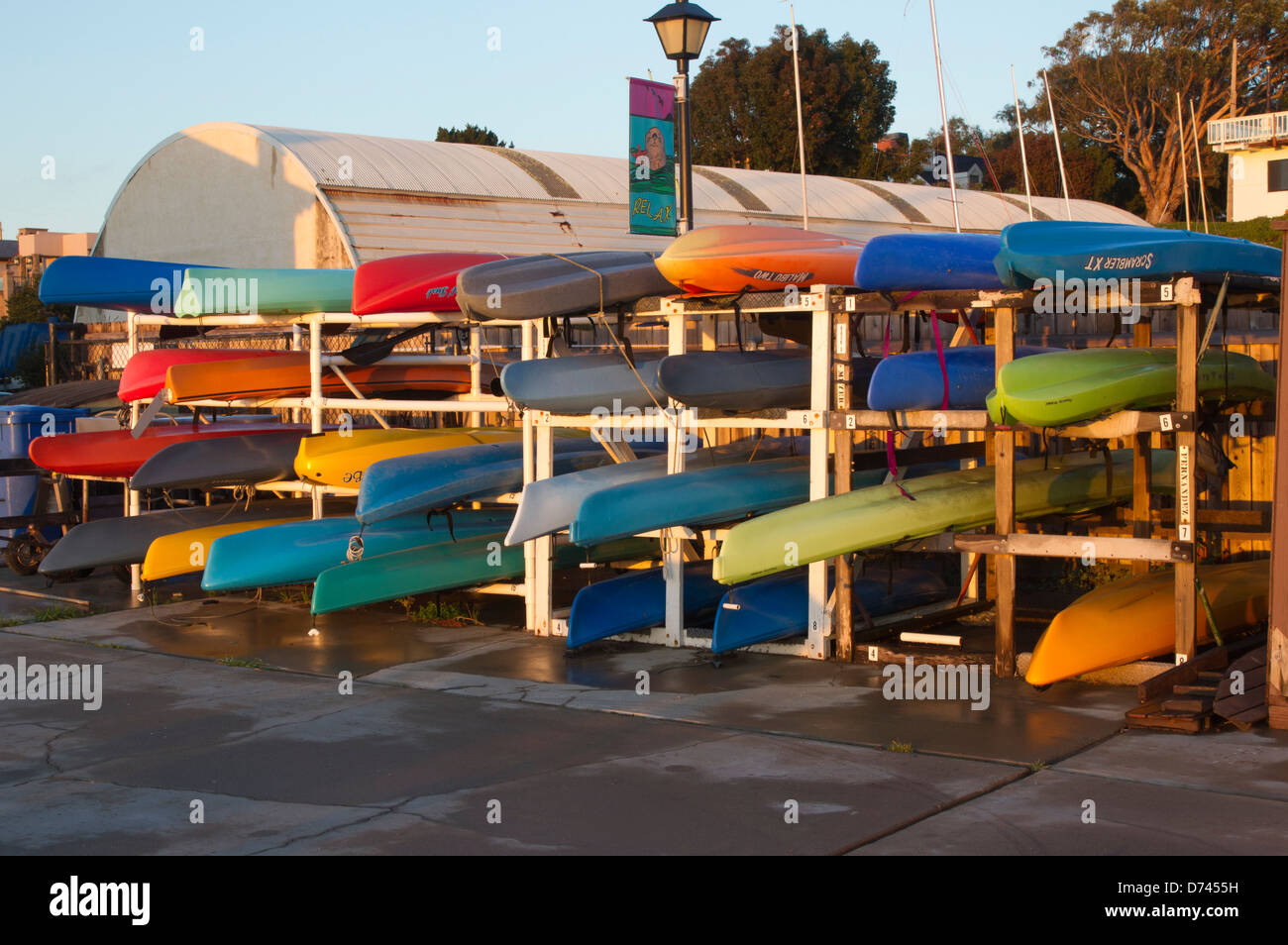 Stowed Kayaks of Various Colors Stock Photo