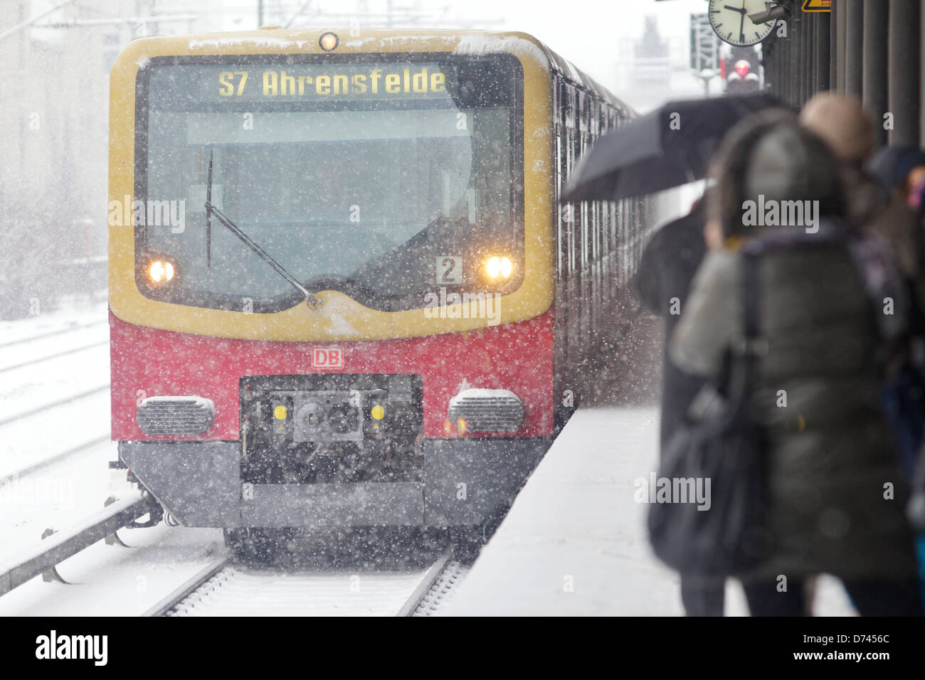 Berlin, Germany, S-train and Passengers with snow on the Charlottenburg S-Bahn station Stock Photo