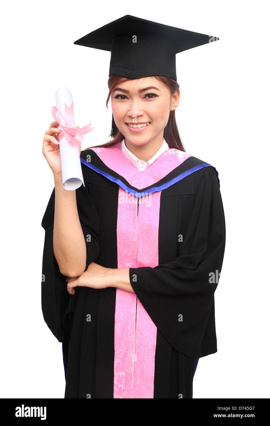 young woman with graduation cap and gown with arm raised holding diploma Stock Photo