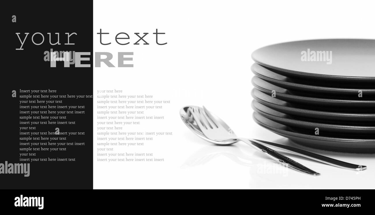 Stack of brown round plates with spoon and fork. Black and white image (with sample text) Stock Photo