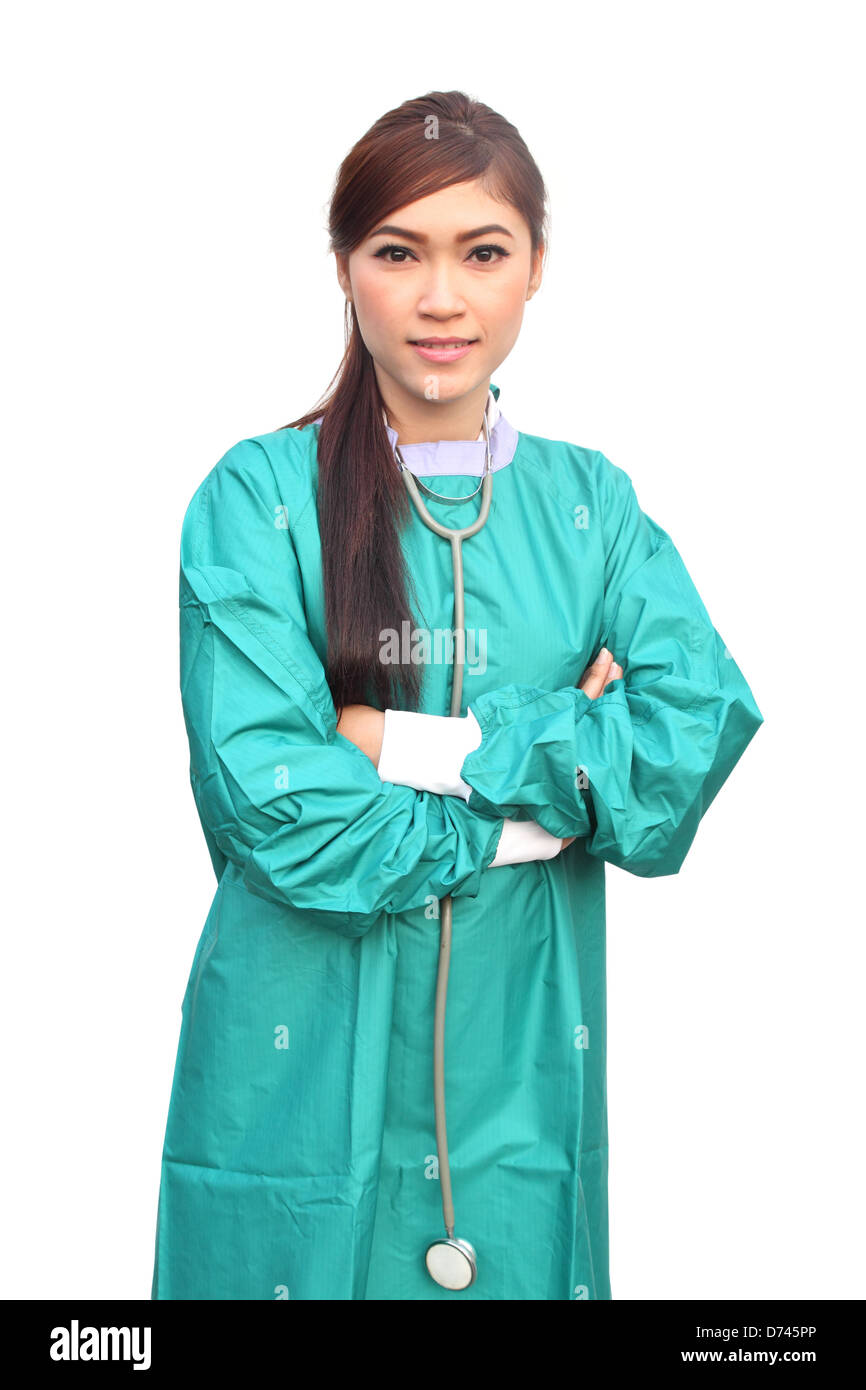 female doctor wearing a green scrubs and stethoscope on white background Stock Photo