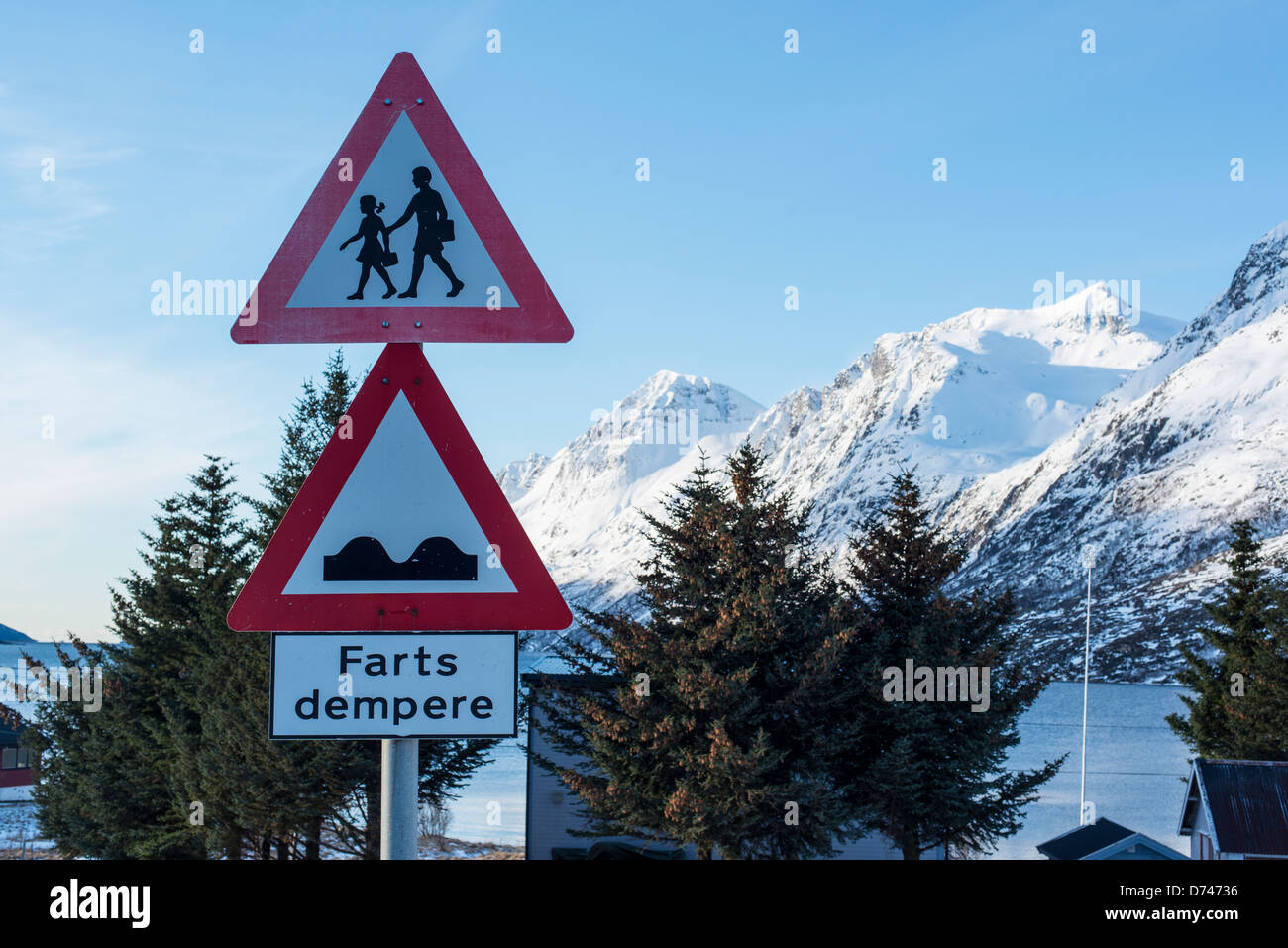 Warning sign for bumps in the road to reduce speed Stock Photo