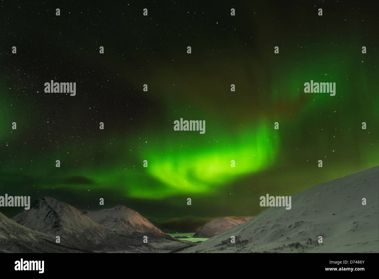 Northern Lights dancing over the hills in Norway Stock Photo - Alamy