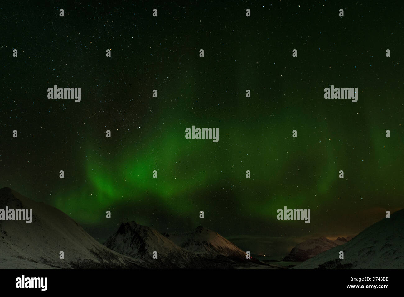 Northern Lights dancing over the hills in Norway Stock Photo - Alamy