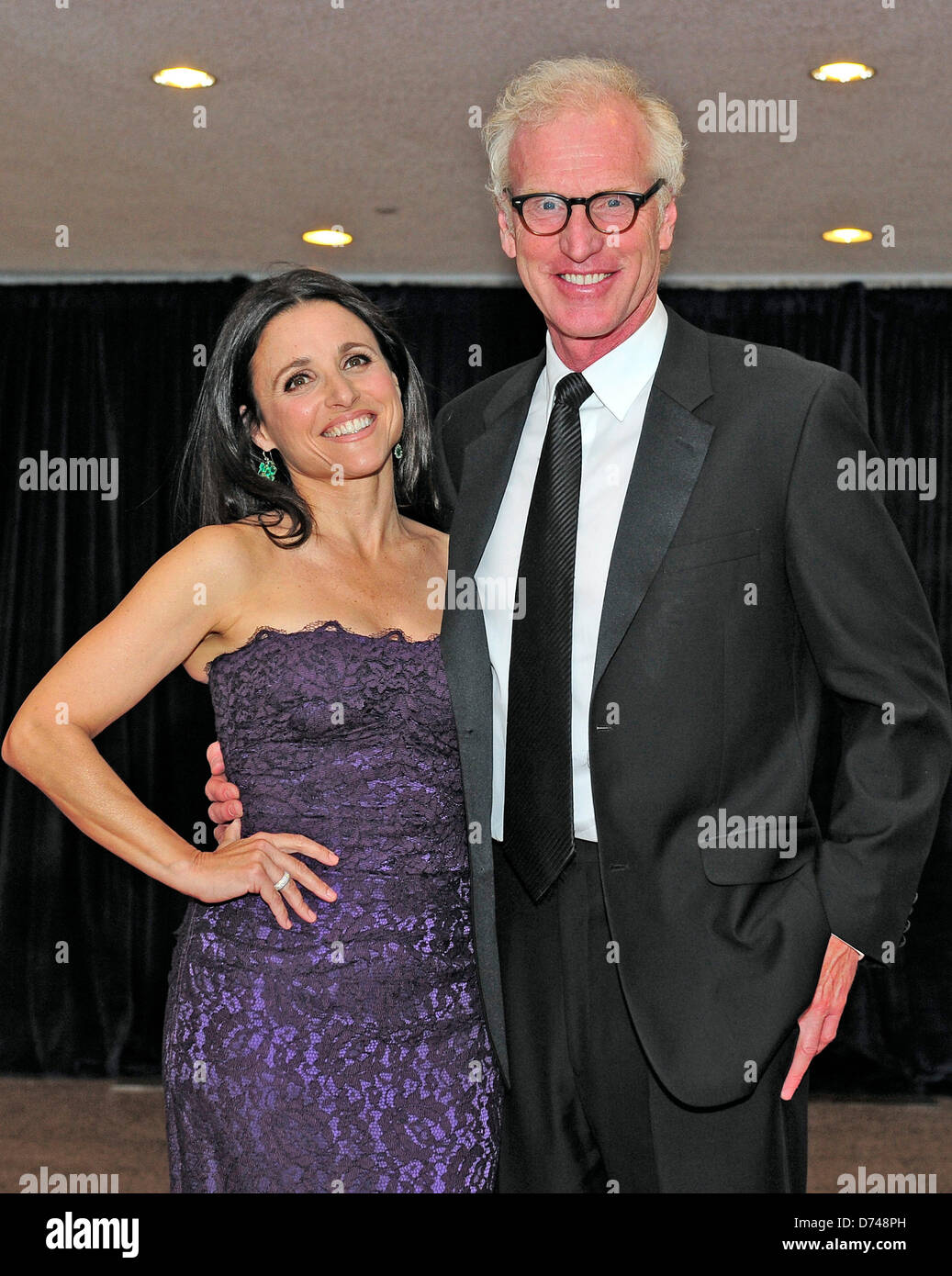 Julia Louis-Dreyfus and her husband, Brad Hall, arrive for the 2013 White House Correspondents Association Annual Dinner at the Washington Hilton Hotel on Saturday, April 27, 2013..Credit: Ron Sachs / CNP.(RESTRICTION: NO New York or New Jersey Newspapers or newspapers within a 75 mile radius of New York City) Stock Photo