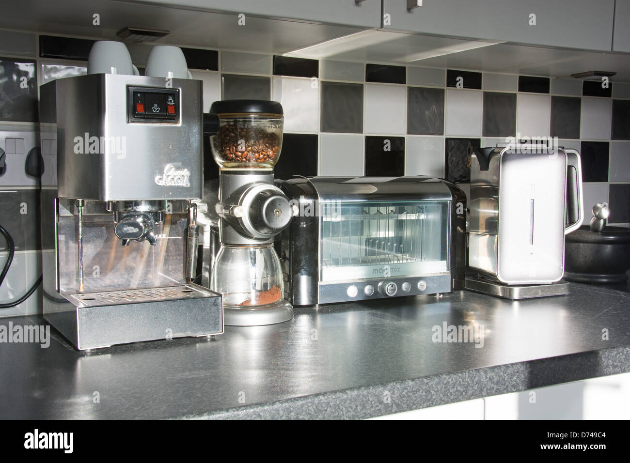 https://c8.alamy.com/comp/D749C4/modern-kitchen-appliances-coffee-machine-bean-grinder-toaster-kettle-D749C4.jpg