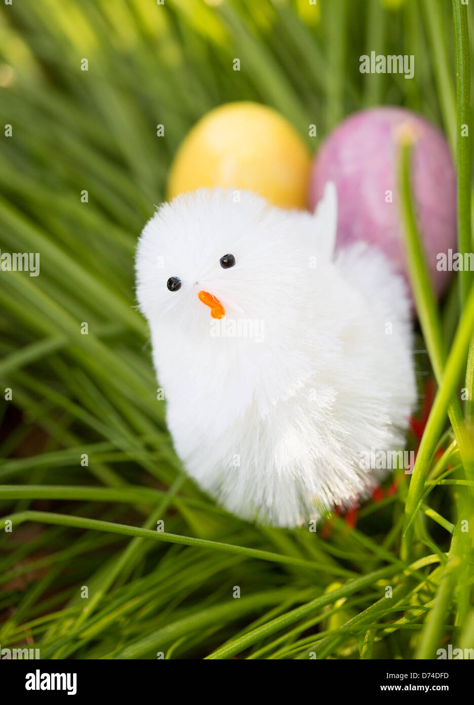 Alabaster Easter Eggs hidden in a patch of grass for the kids to find with a little Easter chic. Stock Photo